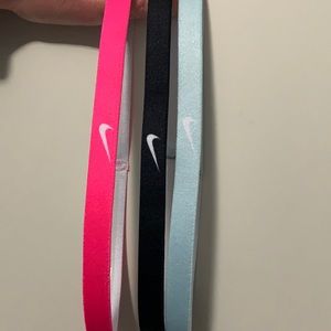 Three Nike headbands - pink, blue and black